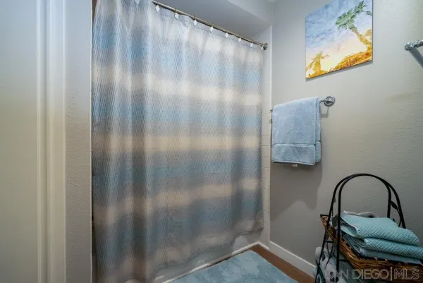 a view of a bathroom with a sink and glass door