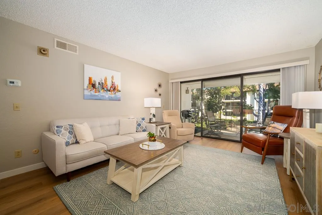17617 Pomerado Road, Unit 215 San Diego, CA 92128 - Photo 4 of 57 a living room with furniture and a large window