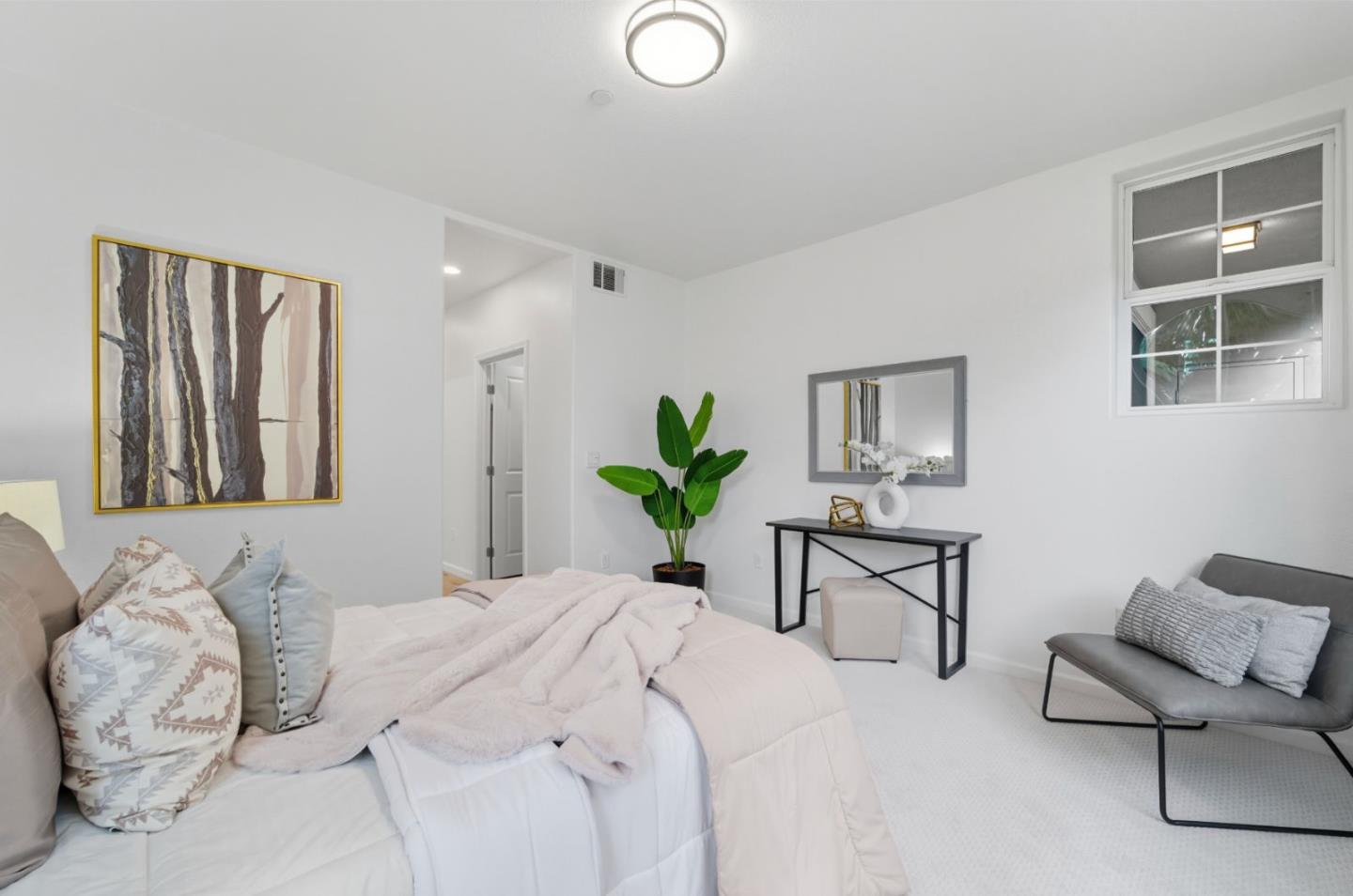 1388 Broadway, Unit 201 Millbrae, CA 94030 - Photo 11 of 33 a bedroom with a bed and a chair