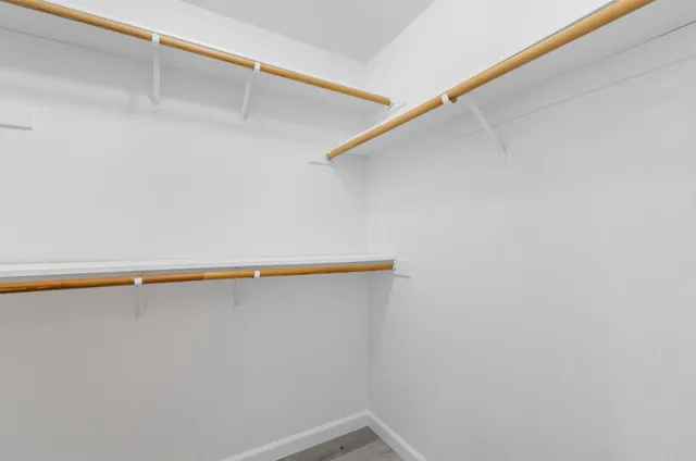 a bathroom with a double vanity sink mirror double and shower