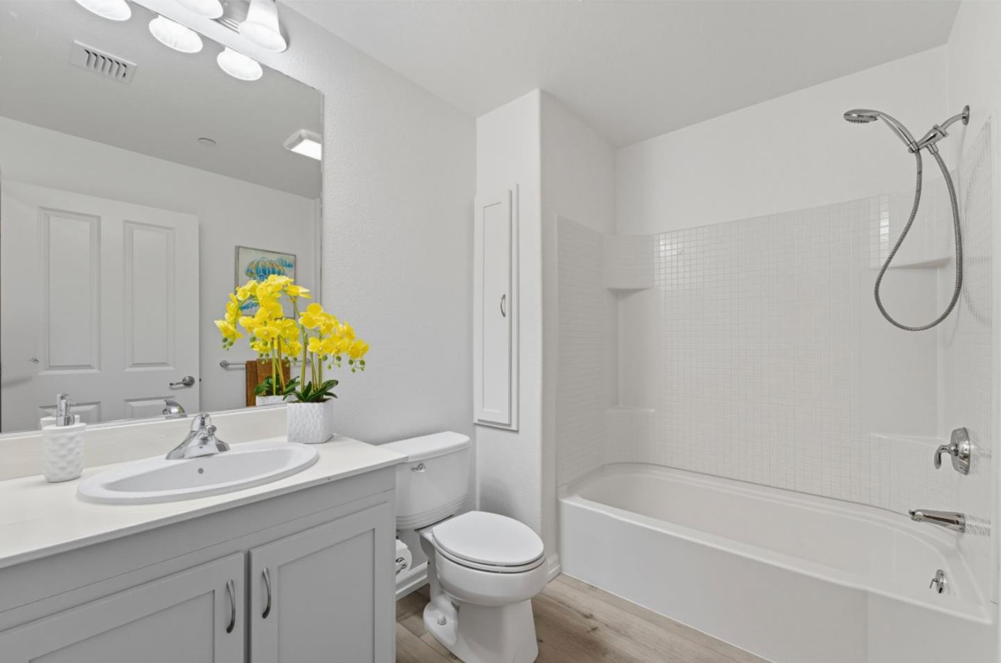 1388 Broadway, Unit 201 Millbrae, CA 94030 - Photo 16 of 33 a bathroom with a sink a toilet and shower