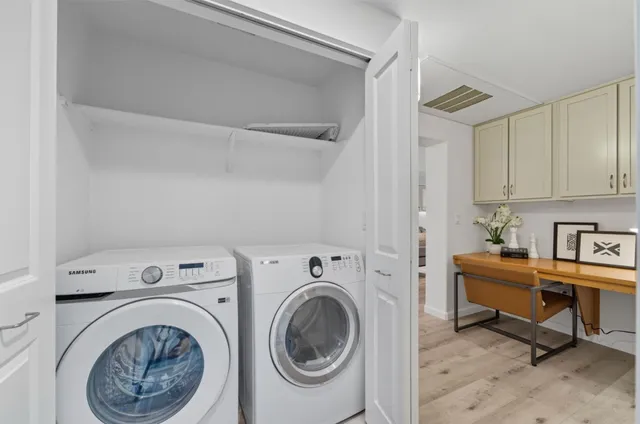 a kitchen with stainless steel appliances granite countertop a stove and a refrigerator