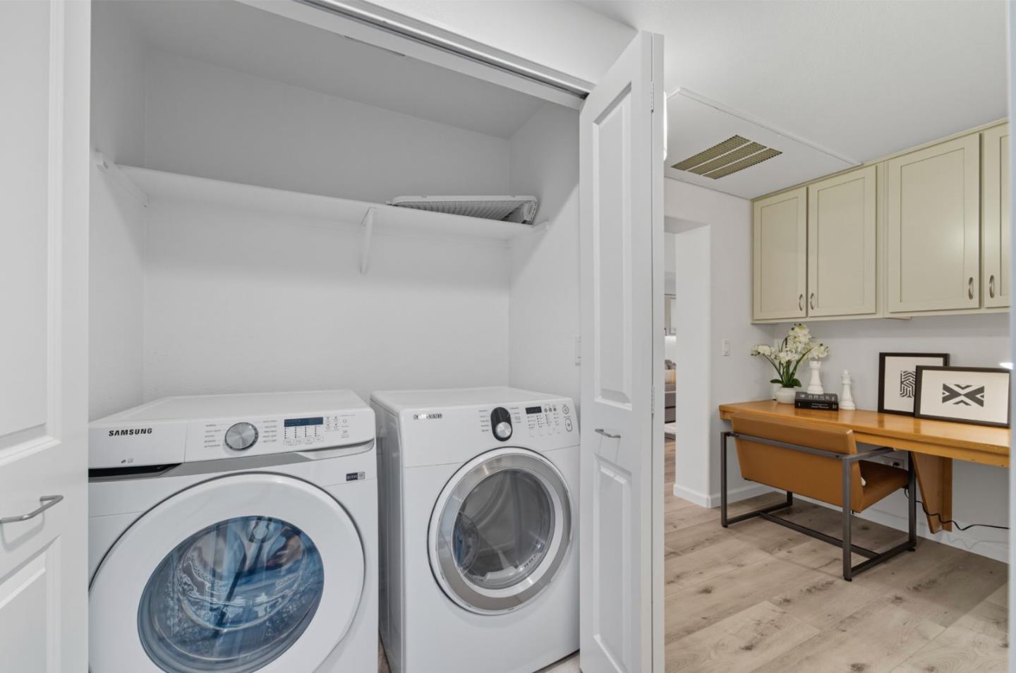 1388 Broadway, Unit 201 Millbrae, CA 94030 - Photo 17 of 33 a view of a room with washer and dryer