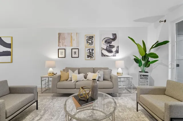 a living room with furniture and a table