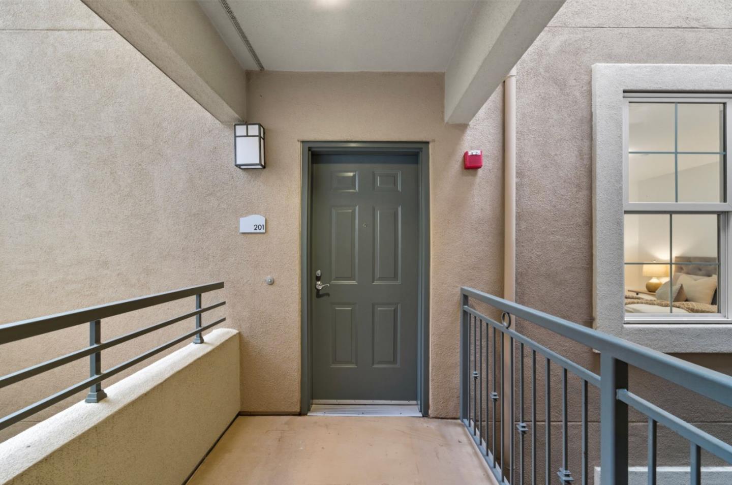 1388 Broadway, Unit 201 Millbrae, CA 94030 - Photo 22 of 33 a view of a hallway with wooden floor and entryway