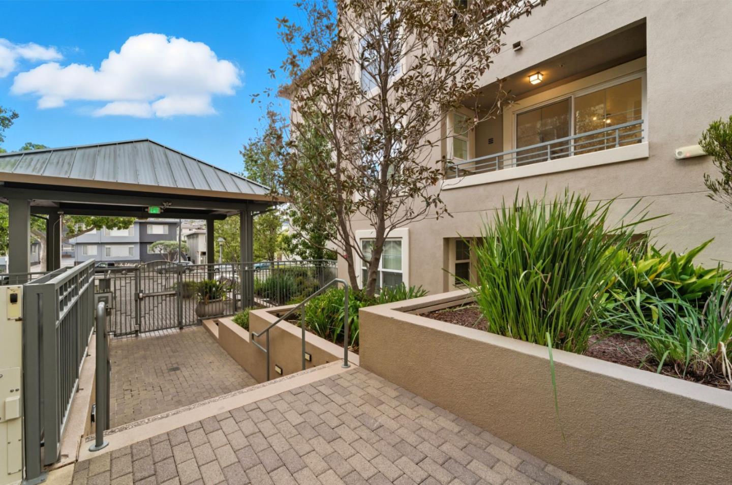 1388 Broadway, Unit 201 Millbrae, CA 94030 - Photo 23 of 33 a view of a terrace with chairs and a small yard