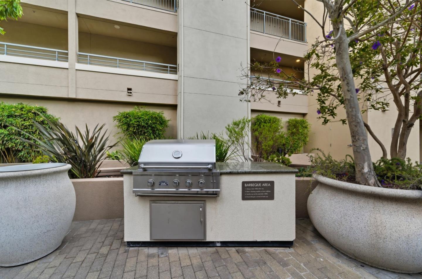1388 Broadway, Unit 201 Millbrae, CA 94030 - Photo 26 of 33 a view of roof deck with potted plants and more windows