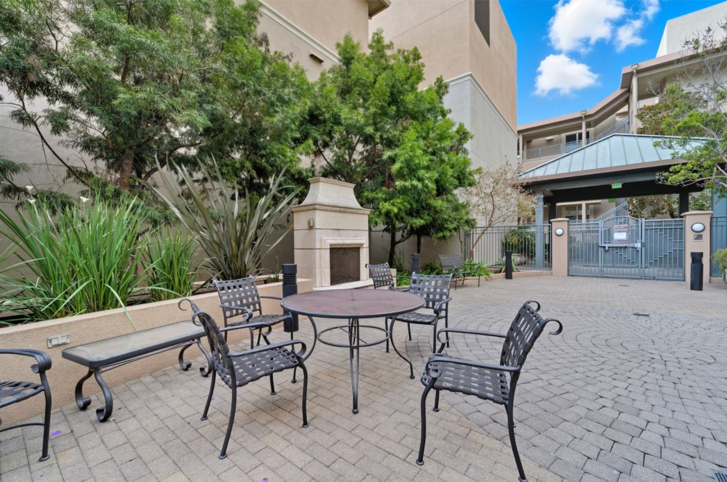 1388 Broadway, Unit 201 Millbrae, CA 94030 - Photo 27 of 33 a view of a patio with table and chairs and potted plants