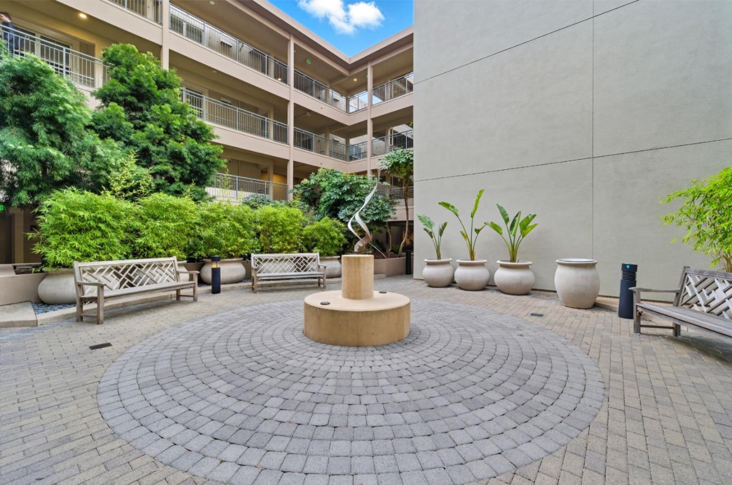 1388 Broadway, Unit 201 Millbrae, CA 94030 - Photo 28 of 33 a building outdoor space with patio furniture and potted plants