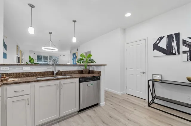 a view of hallway with wooden floor