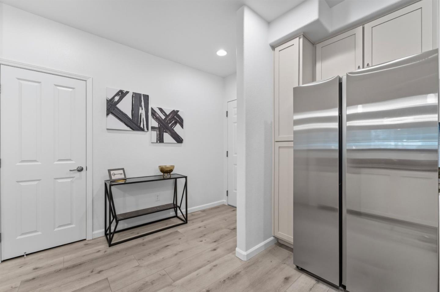 1388 Broadway, Unit 201 Millbrae, CA 94030 - Photo 6 of 33 a view of hallway with wooden floor