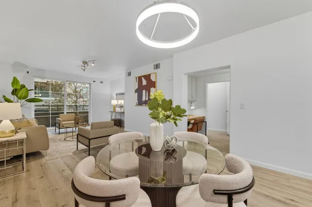 a dining room with furniture and window