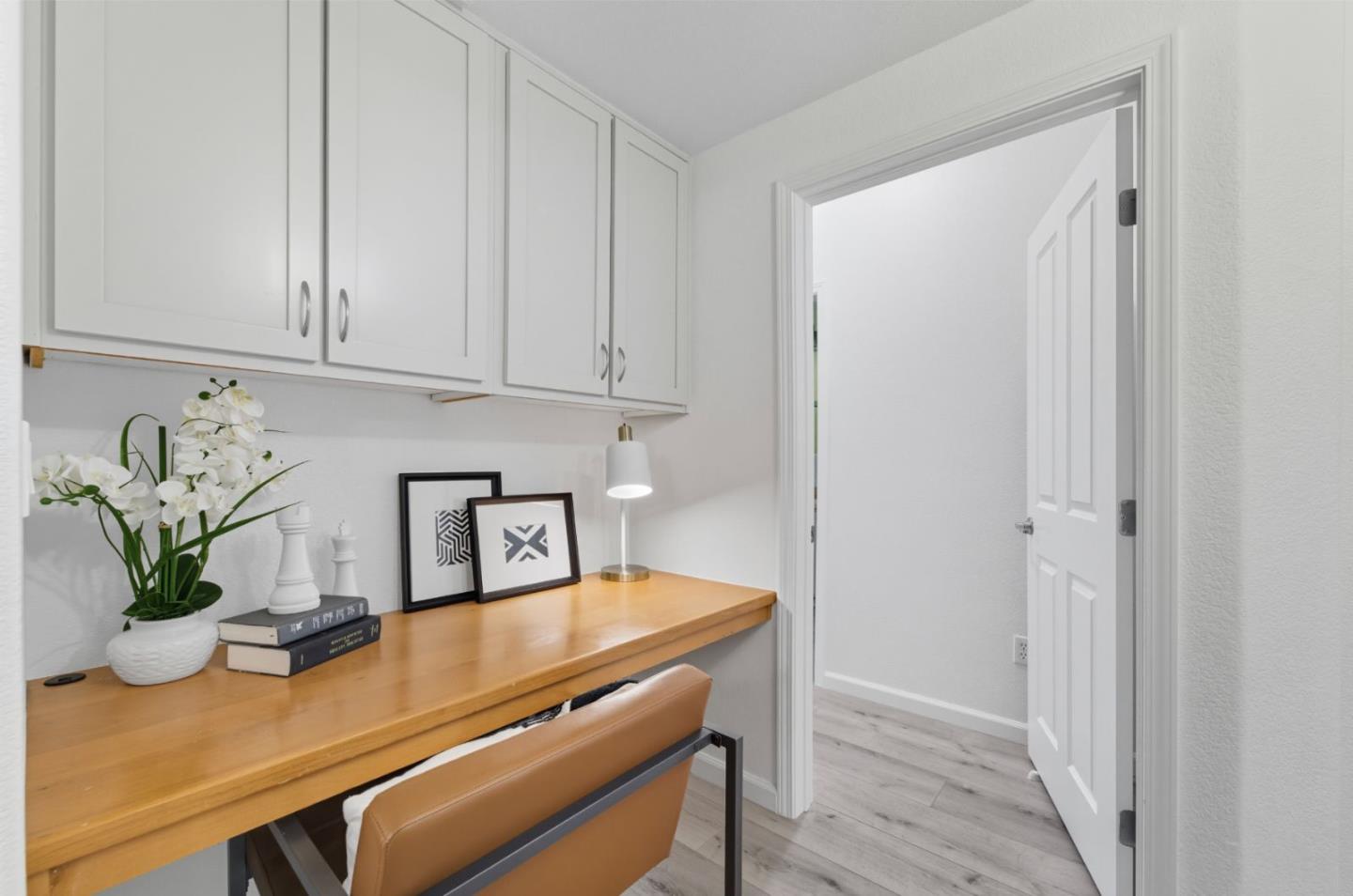 1388 Broadway, Unit 201 Millbrae, CA 94030 - Photo 9 of 33 a room with storage and utility room with wooden floor
