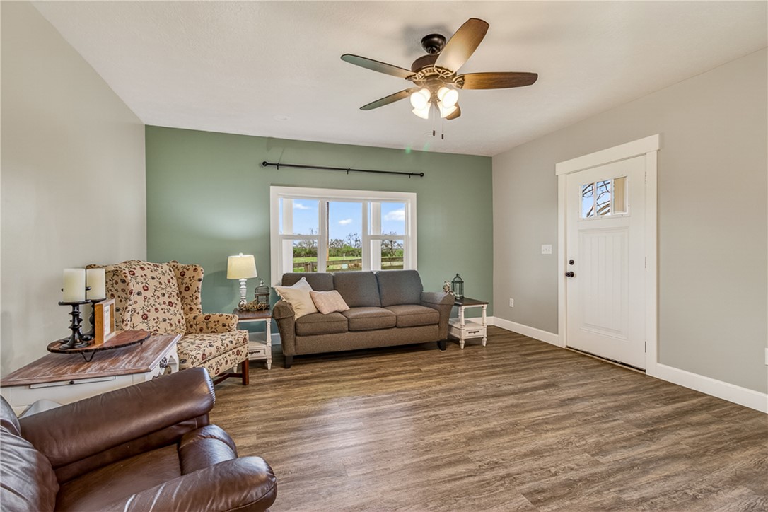 8700 Quaker Trace Road Camden, OH 45311 - Photo 4 of 34 This living room features a bright window and durable flooring.