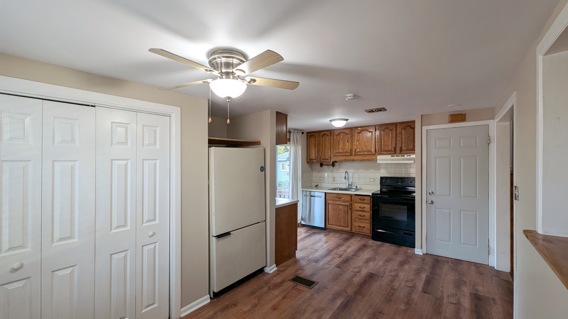 1710 North Raynor Avenue Crest Hill, IL 60403 - Photo 4 of 8 a kitchen with kitchen island white cabinets and stainless steel appliances