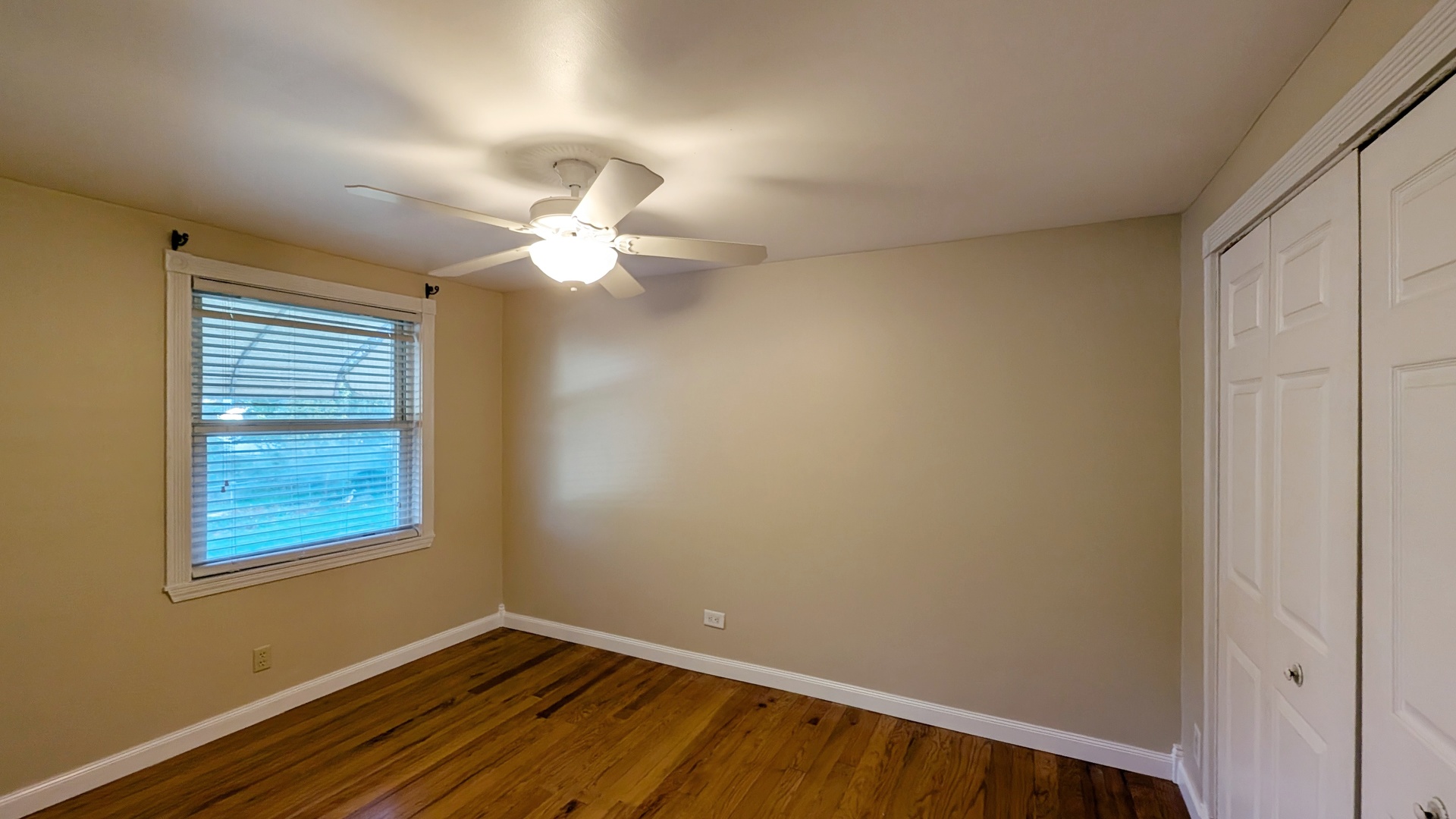 1710 North Raynor Avenue Crest Hill, IL 60403 - Photo 6 of 8 a view of a room with a ceiling fan and a window