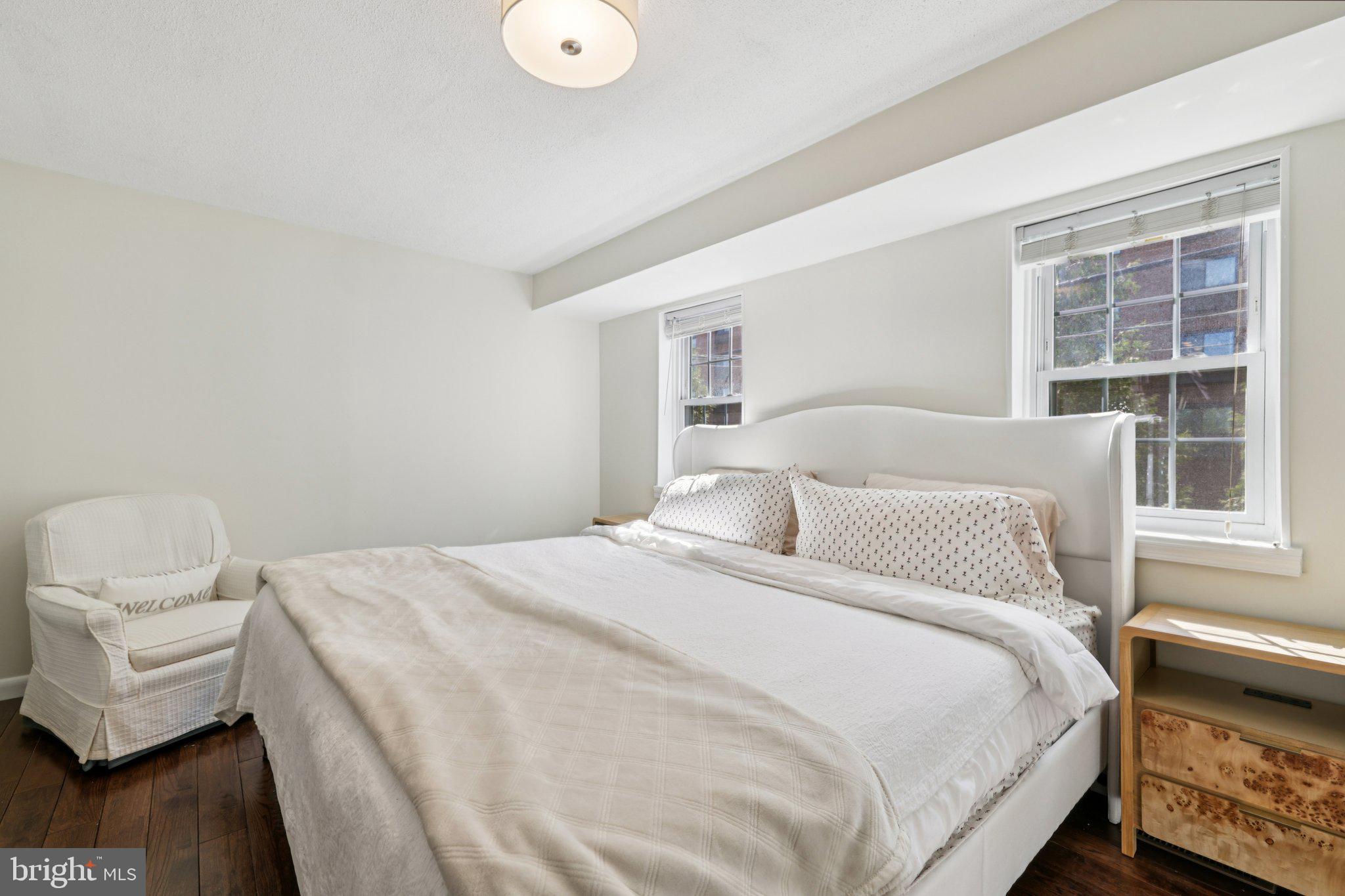 617 South Durham Street Baltimore, MD 21231 - Photo 13 of 42 a bedroom with a bed and wooden floor