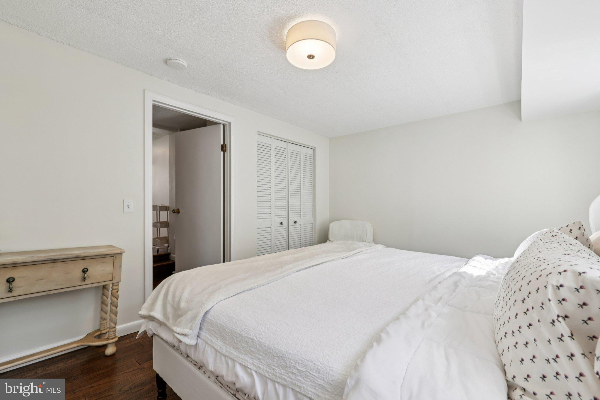 617 South Durham Street Baltimore, MD 21231 - Photo 14 of 42 a bedroom with a bed and a lamp