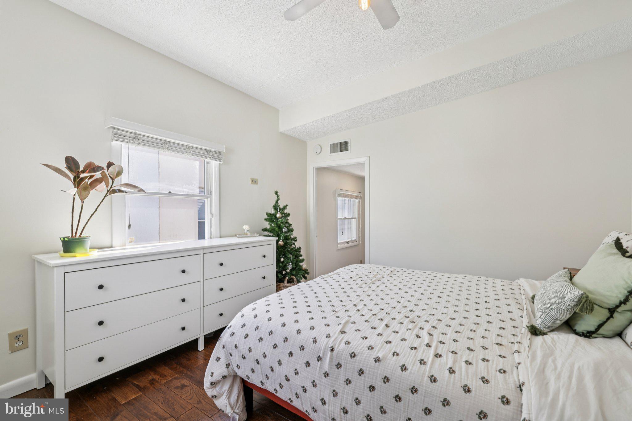 617 South Durham Street Baltimore, MD 21231 - Photo 20 of 42 a bedroom with a bed and a dresser