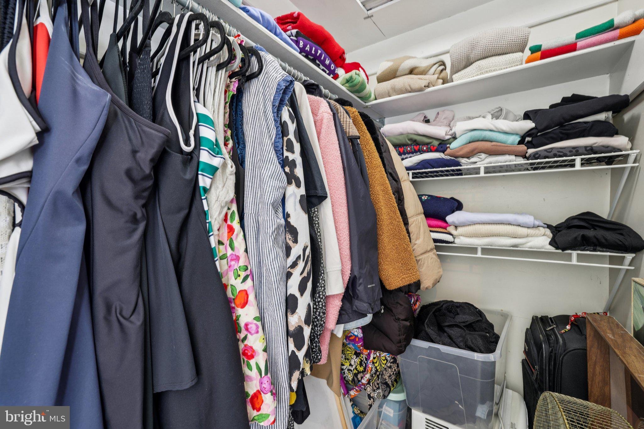 617 South Durham Street Baltimore, MD 21231 - Photo 21 of 42 a view of walk in closet with clothes and shoes