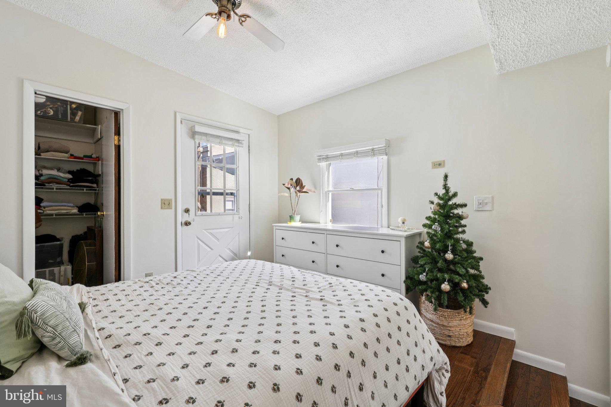 617 South Durham Street Baltimore, MD 21231 - Photo 22 of 42 a bedroom with a bed and a chandelier