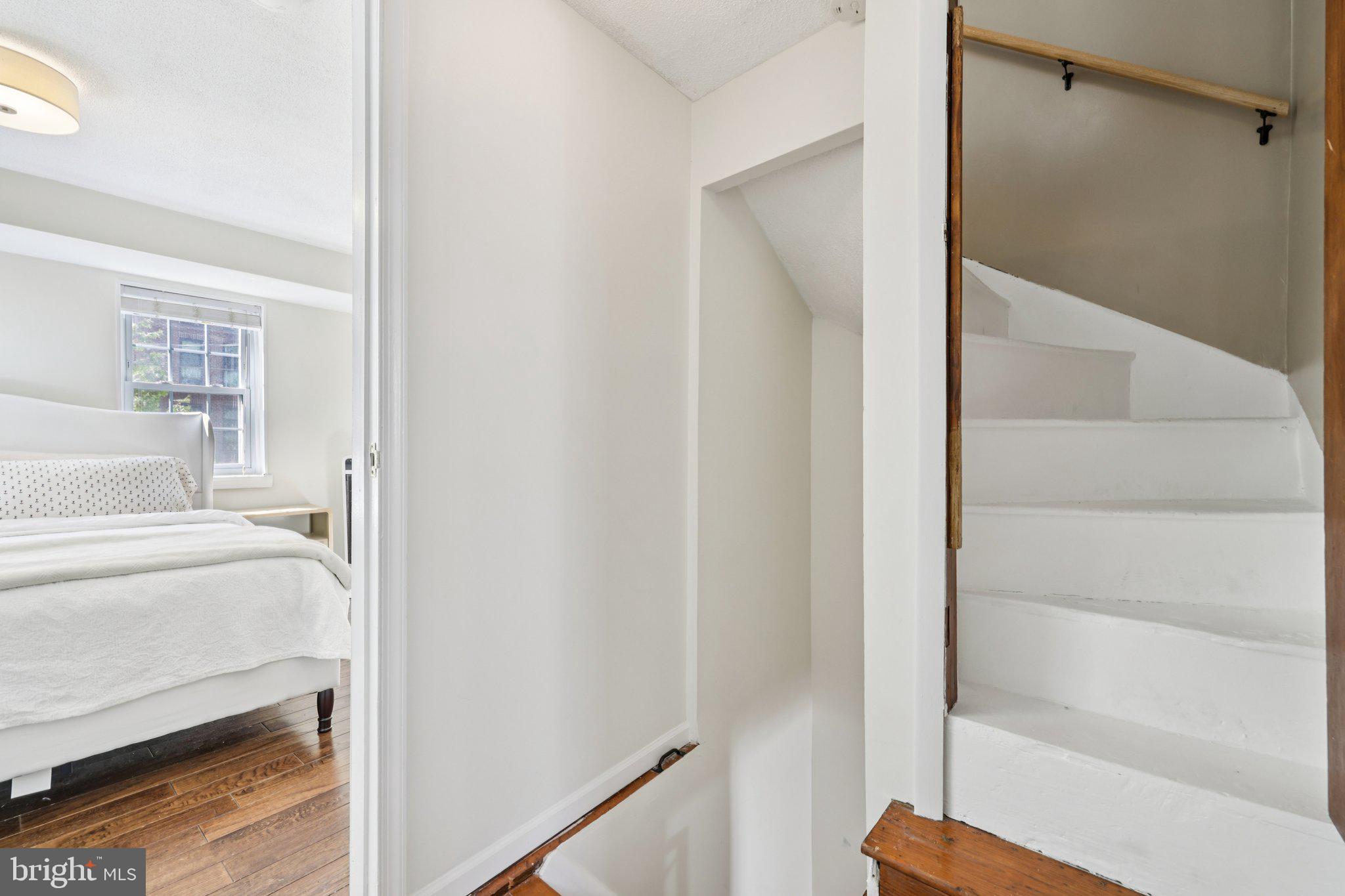 617 South Durham Street Baltimore, MD 21231 - Photo 25 of 42 a view of a bedroom with wooden floor and windows