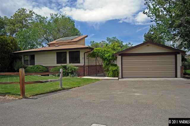 50 Suda Way Reno, NV 89509 - Photo 1 of 1 a front view of a house with plants and garden