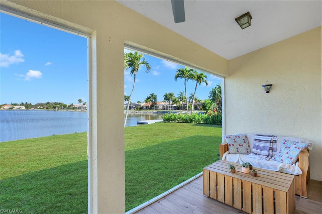 7311 Mill Pond Circle Naples, FL 34109 - Photo 19 of 22 a view of a deck with furniture and garden