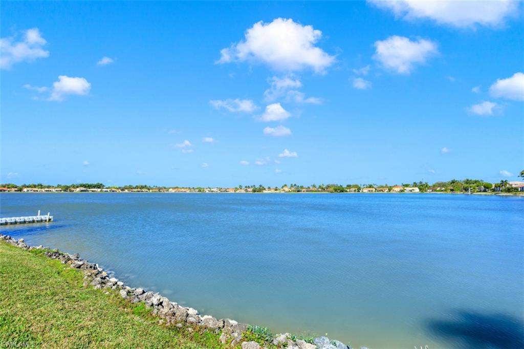 7311 Mill Pond Circle Naples, FL 34109 - Photo 20 of 22 a view of a lake and a mountain