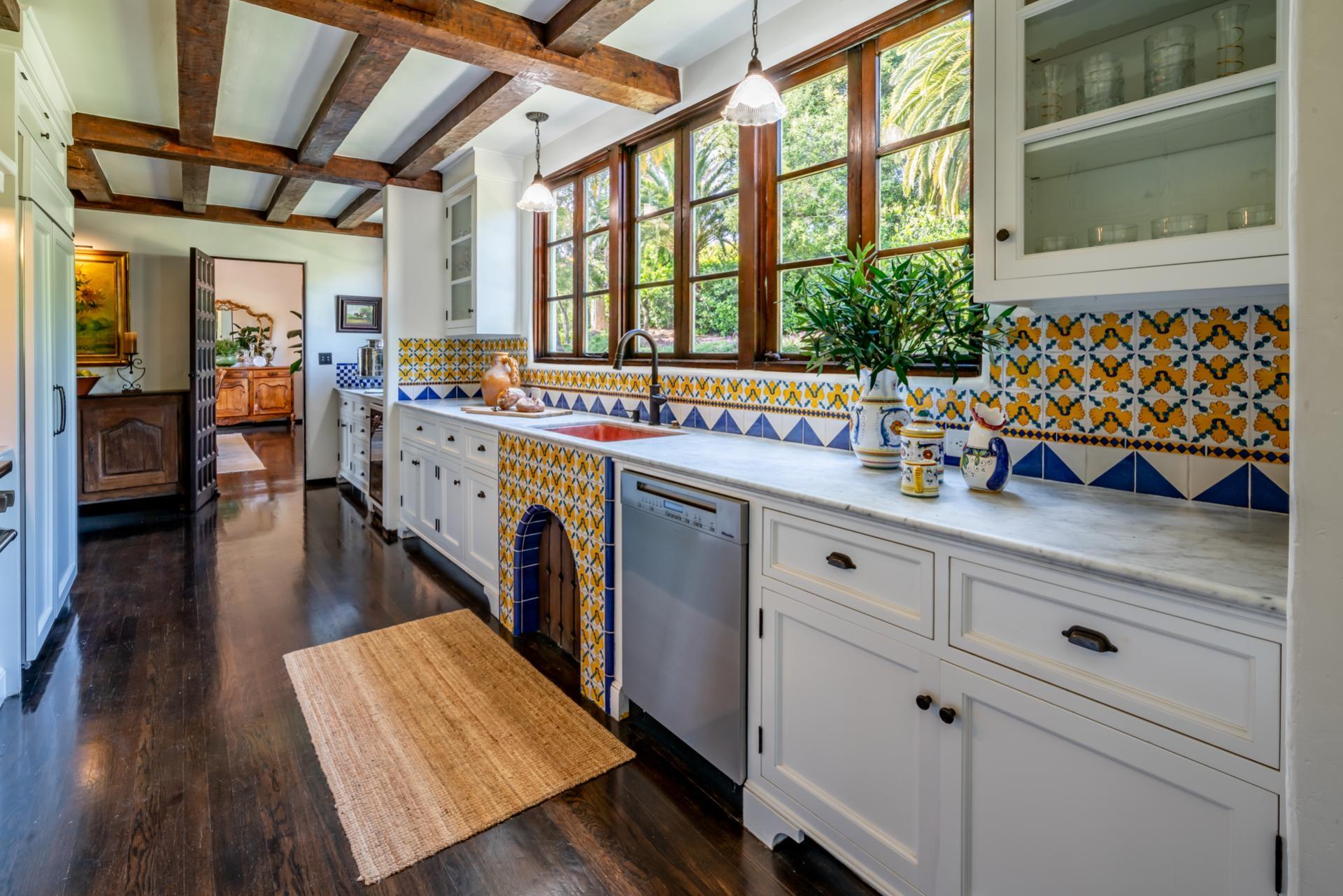 1098 Golf Road Montecito, CA 93108 - Photo 19 of 62 a kitchen with stainless steel appliances granite countertop a lot of counter space and wooden floor