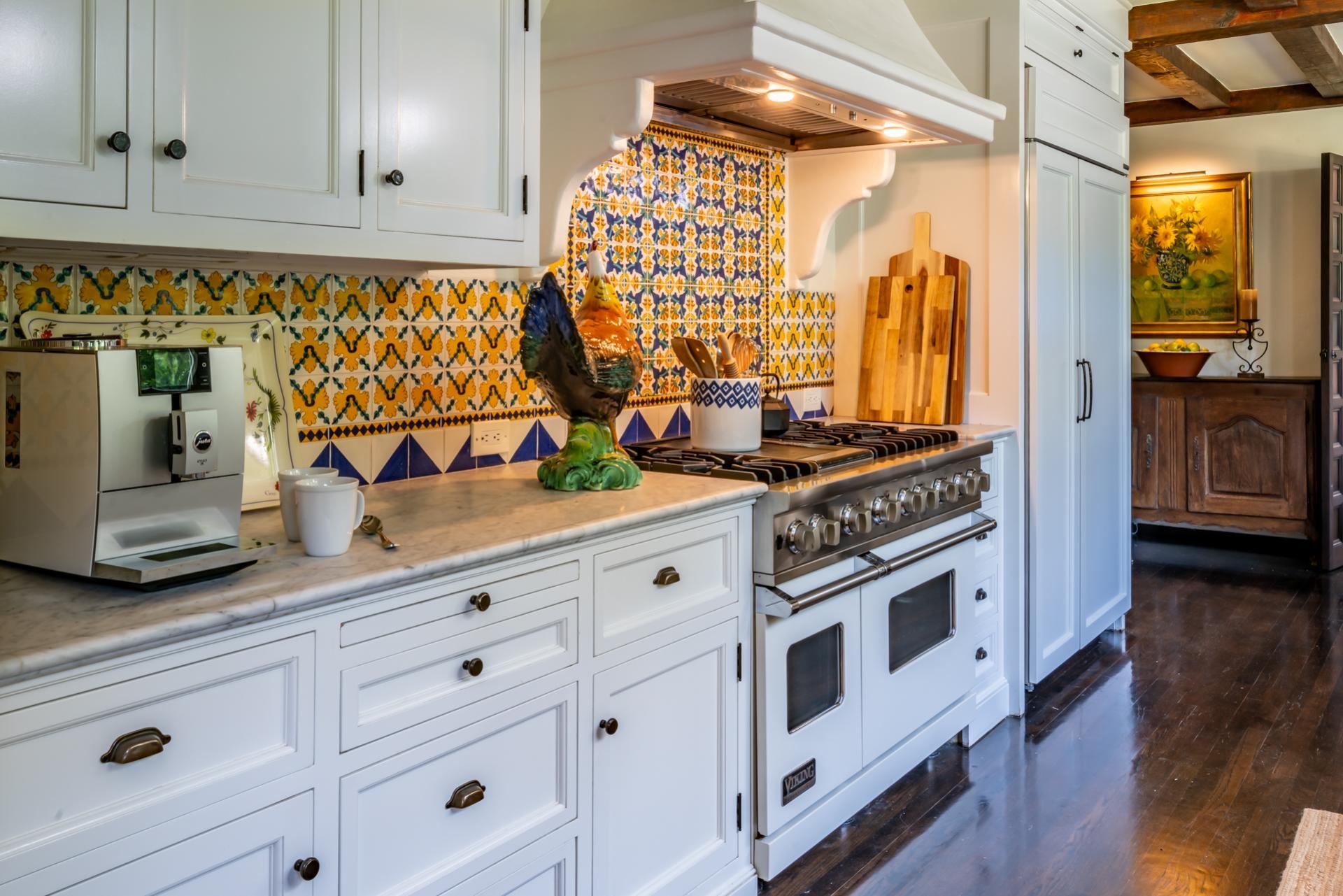 1098 Golf Road Montecito, CA 93108 - Photo 20 of 62 a kitchen with granite countertop white cabinets and white appliances
