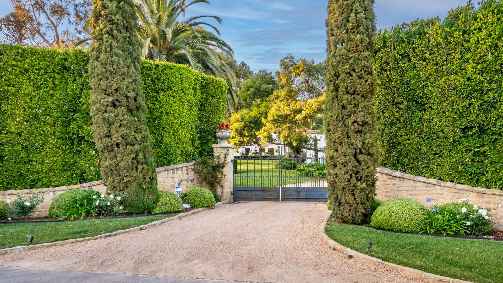 1098 Golf Road Montecito, CA 93108 - Photo 4 of 62 a front view of a house with a yard