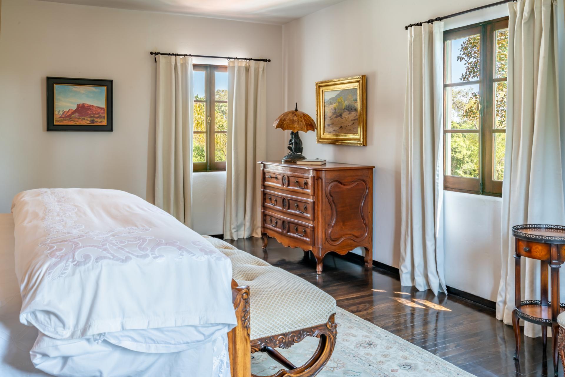 1098 Golf Road Montecito, CA 93108 - Photo 44 of 62 a bedroom with a bed and a dresser in it