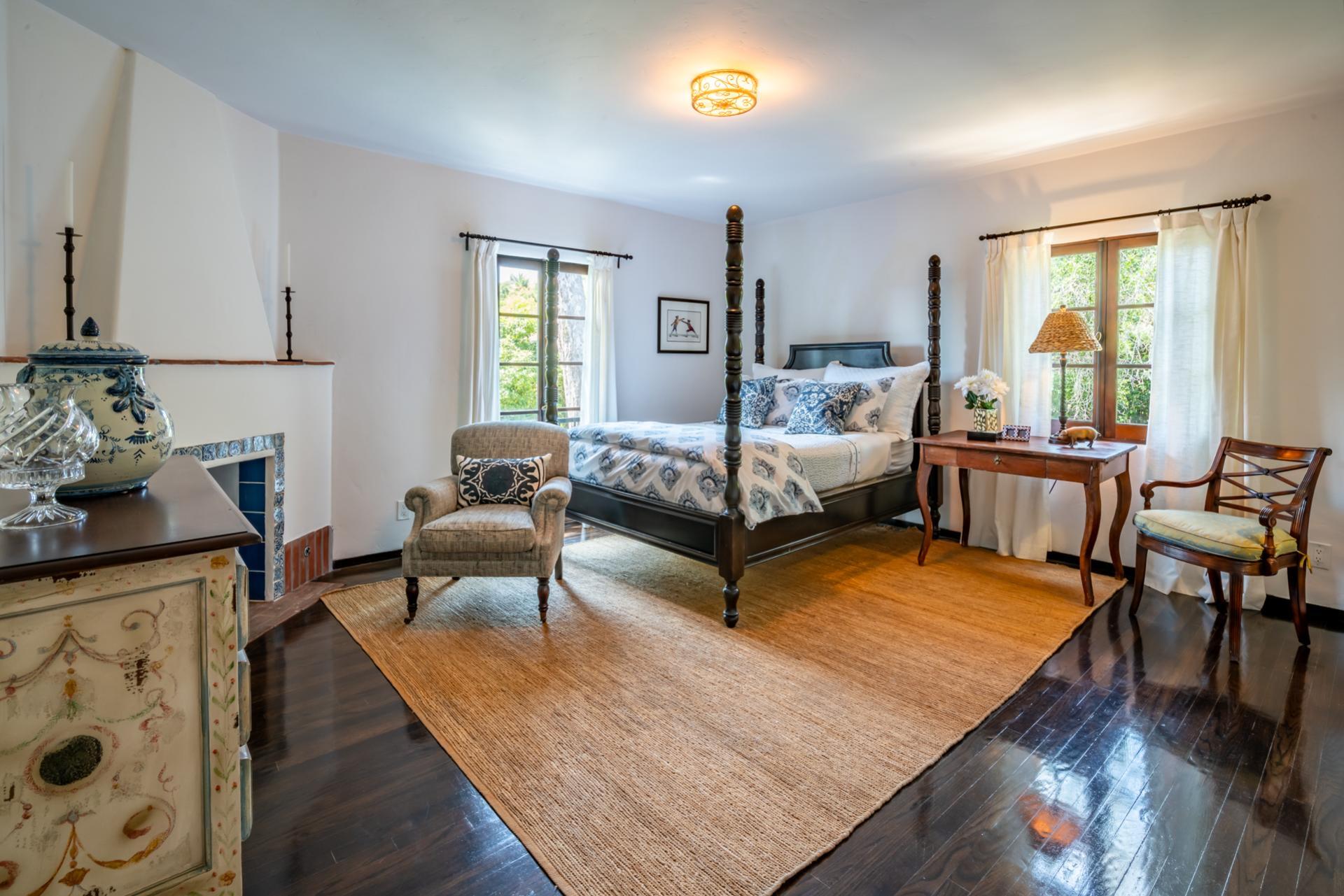 1098 Golf Road Montecito, CA 93108 - Photo 49 of 62 a bedroom with furniture and a wooden floor