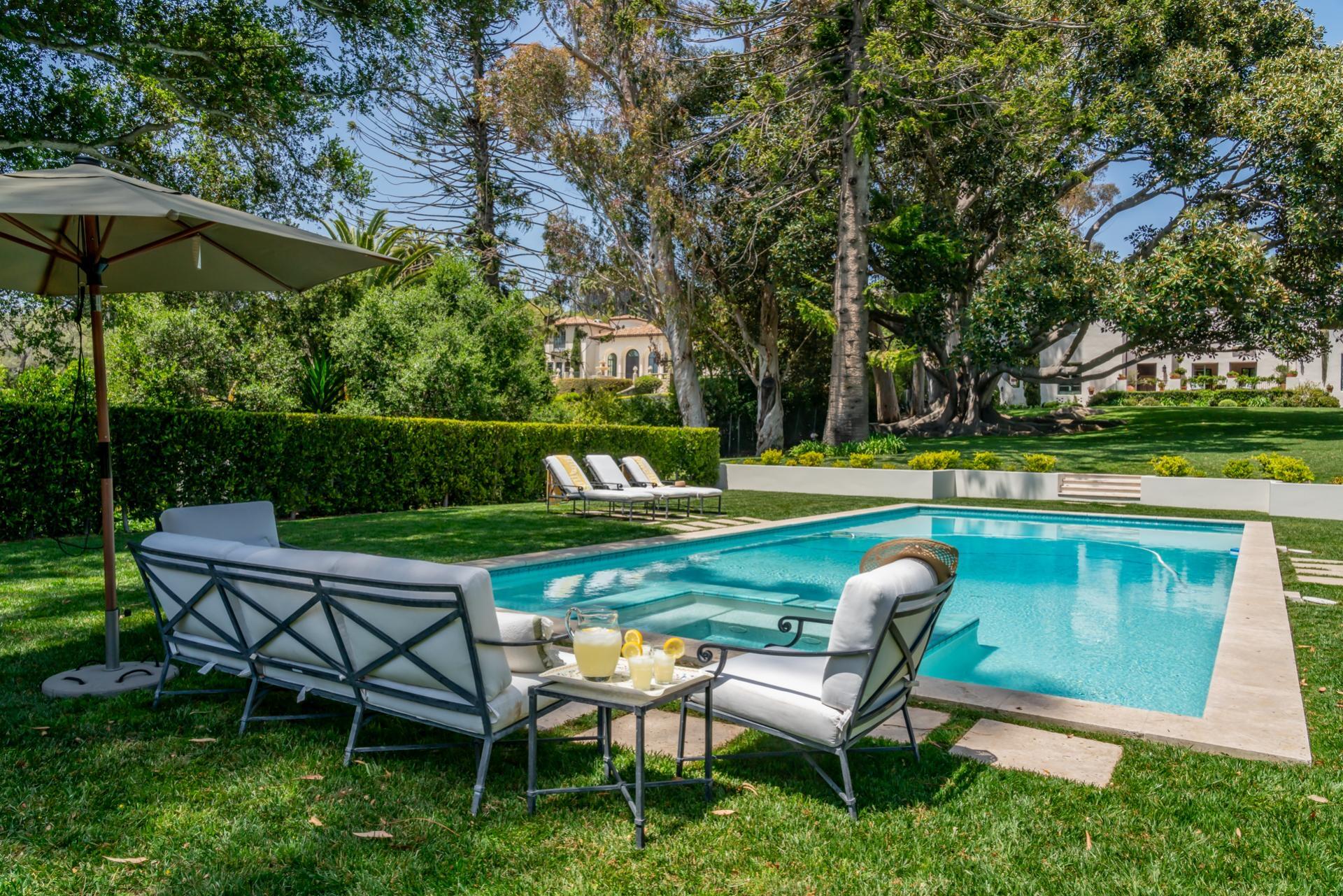 1098 Golf Road Montecito, CA 93108 - Photo 9 of 62 a view of a chair and table on the garden