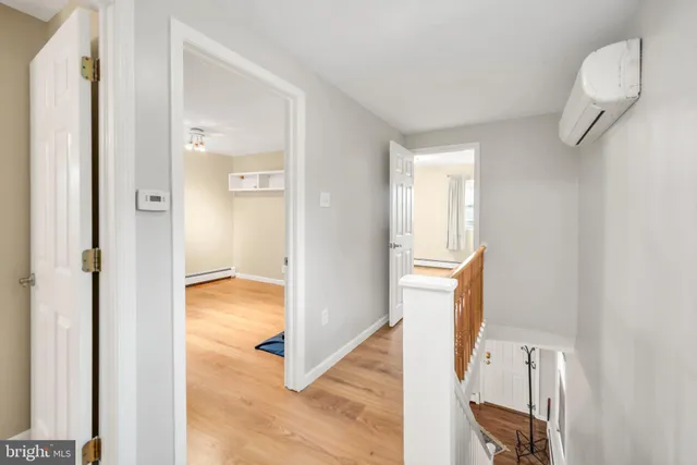 a view of an entryway with wooden floor