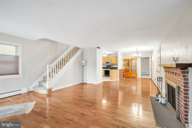 a view of a kitchen with furniture and an empty room