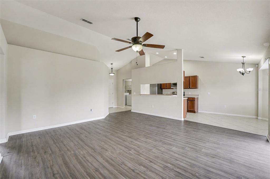 865 Terranova Road Winter Haven, FL 33884 - Photo 2 of 12 a view of a kitchen with a dishwasher cabinets and wooden floor