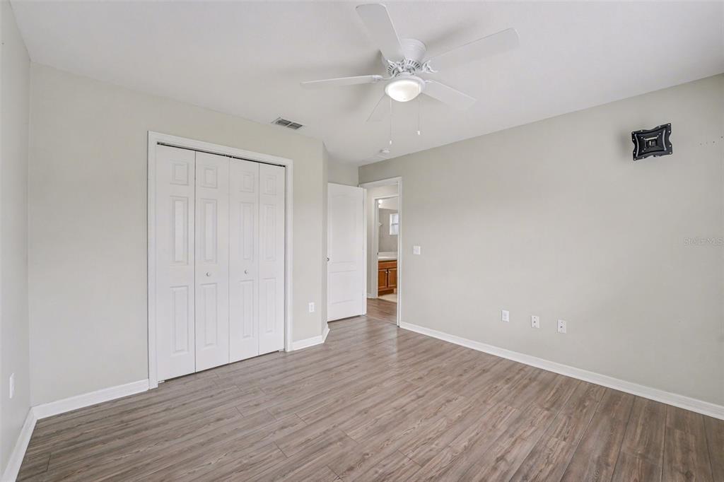 865 Terranova Road Winter Haven, FL 33884 - Photo 10 of 12 a view of an empty room with wooden floor