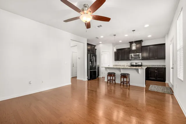 a view of kitchen with microwave and cabinets