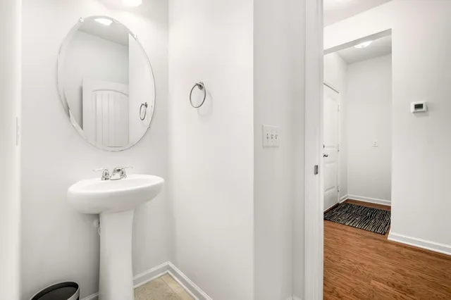 a bathroom with a sink a mirror and a shower