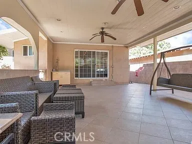 a living room with couches chairs and next to a window