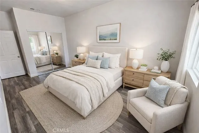 a bedroom with a bed and a couch