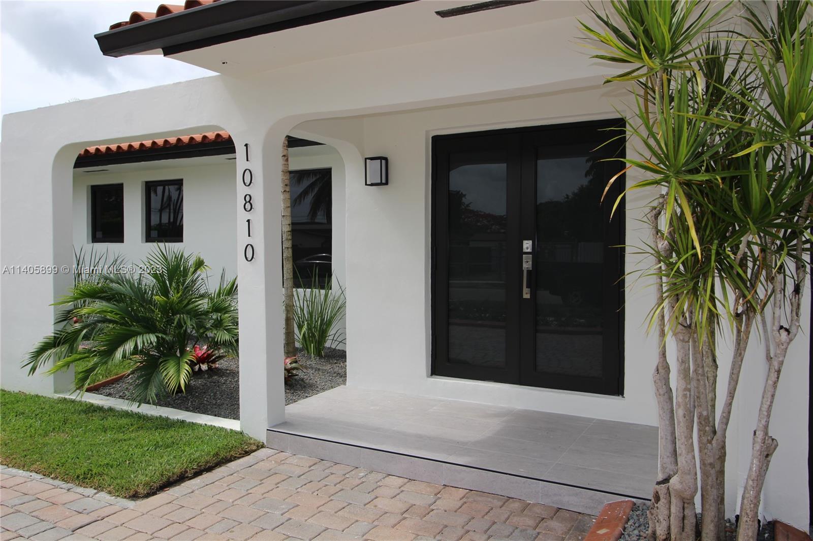 a potted plant in front of a house