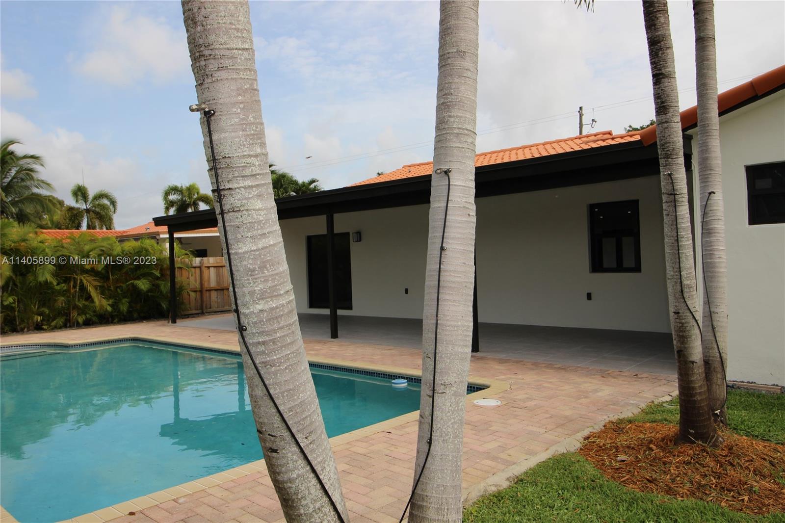 10810 Southwest 28th Street Miami, FL 33165 - Photo 12 of 45 a house view with a backyard space