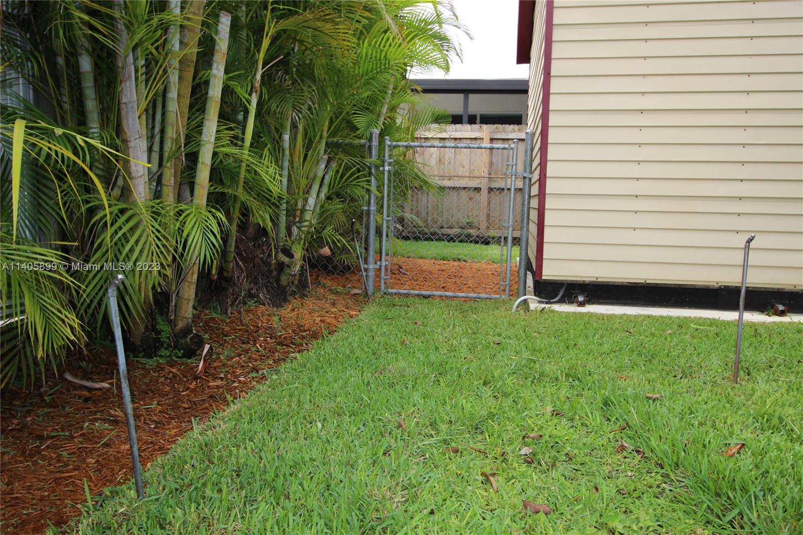 10810 Southwest 28th Street Miami, FL 33165 - Photo 13 of 45 a view of a backyard with plants