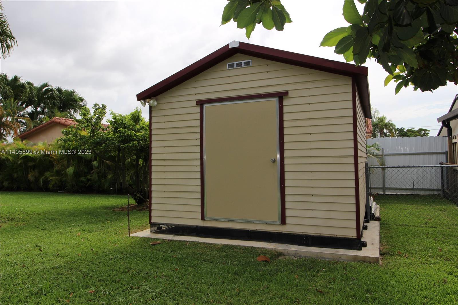 10810 Southwest 28th Street Miami, FL 33165 - Photo 14 of 45 a front view of a house with a yard