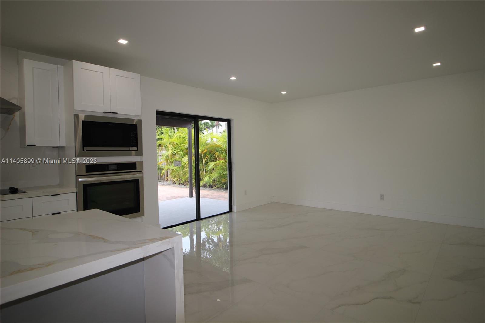 10810 Southwest 28th Street Miami, FL 33165 - Photo 20 of 45 a kitchen with a sink and stainless steel appliances