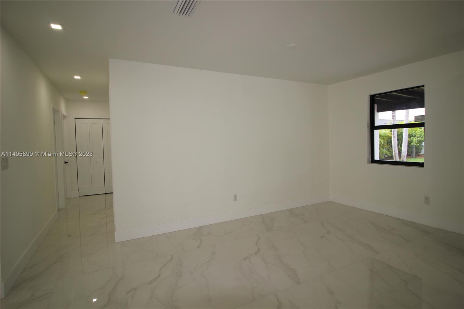 10810 Southwest 28th Street Miami, FL 33165 - Photo 24 of 45 an empty room with a entryway
