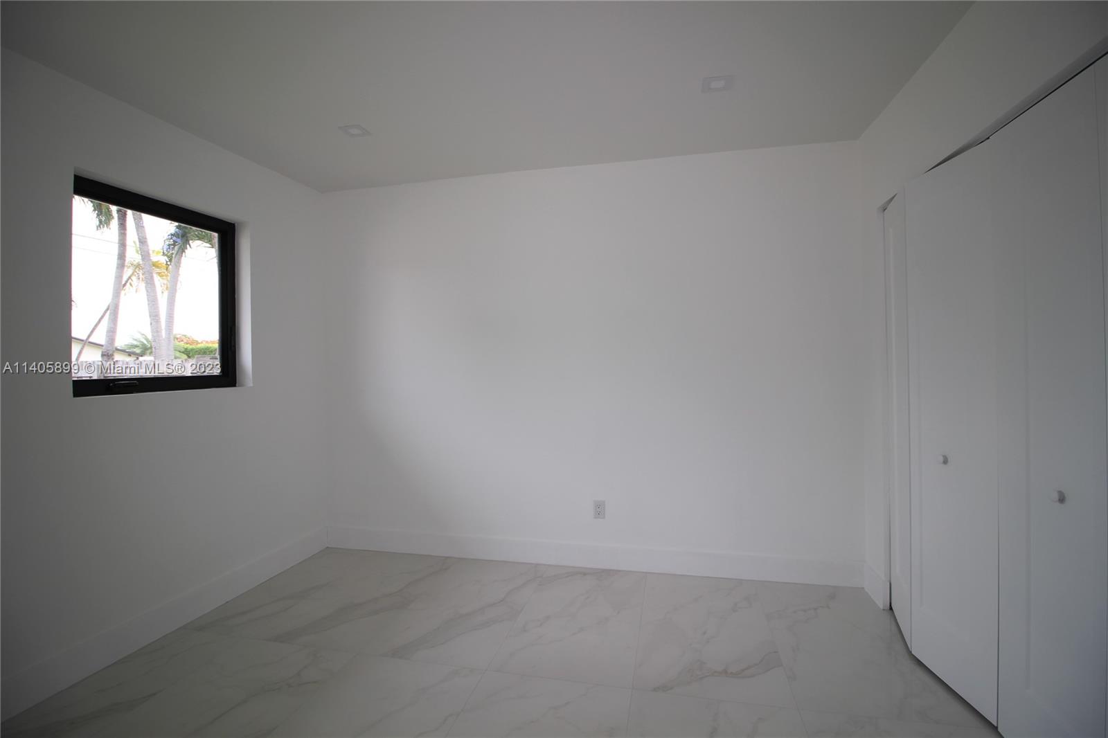 10810 Southwest 28th Street Miami, FL 33165 - Photo 28 of 45 an empty room with a window